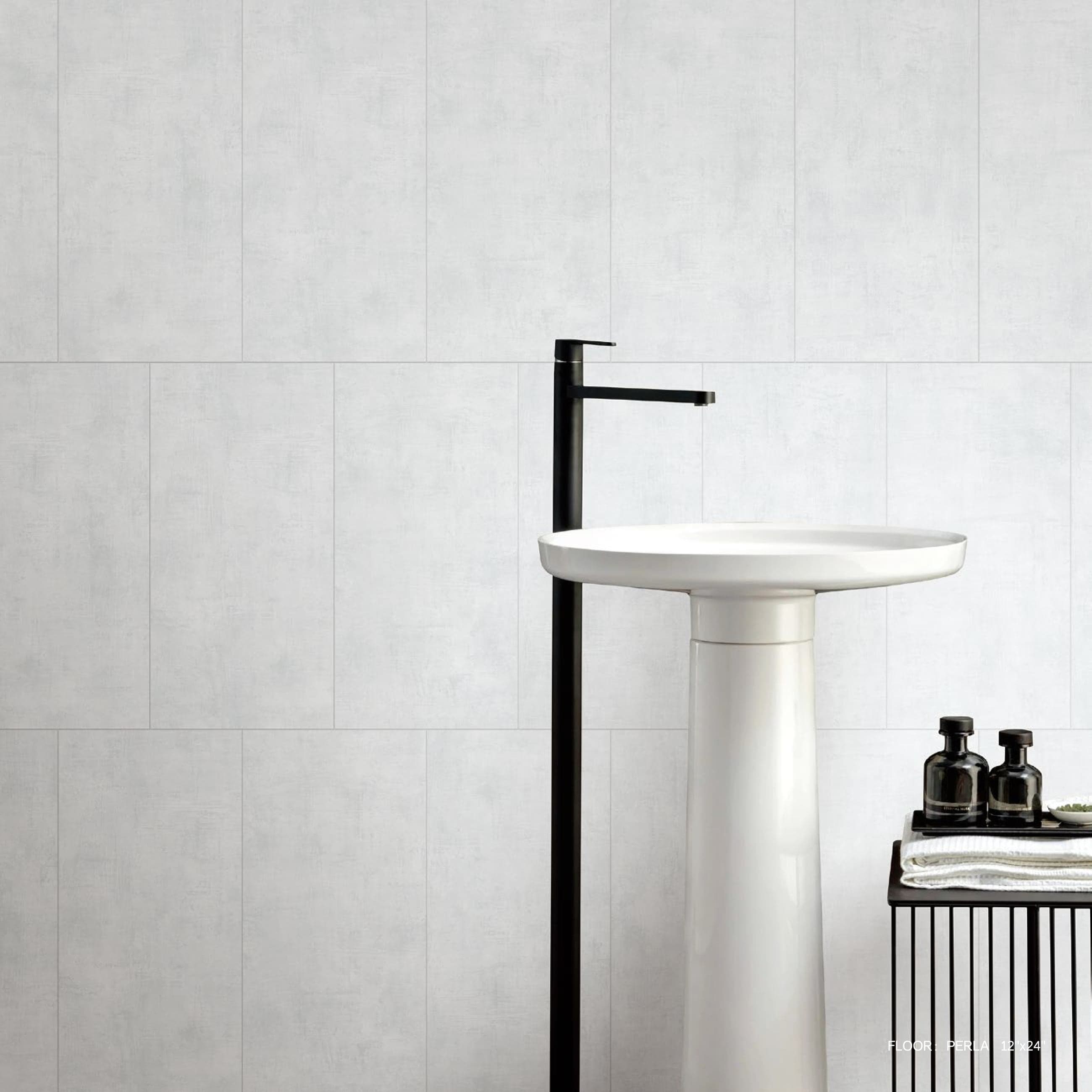LOFT Perla tile behind a white pedestal basin
