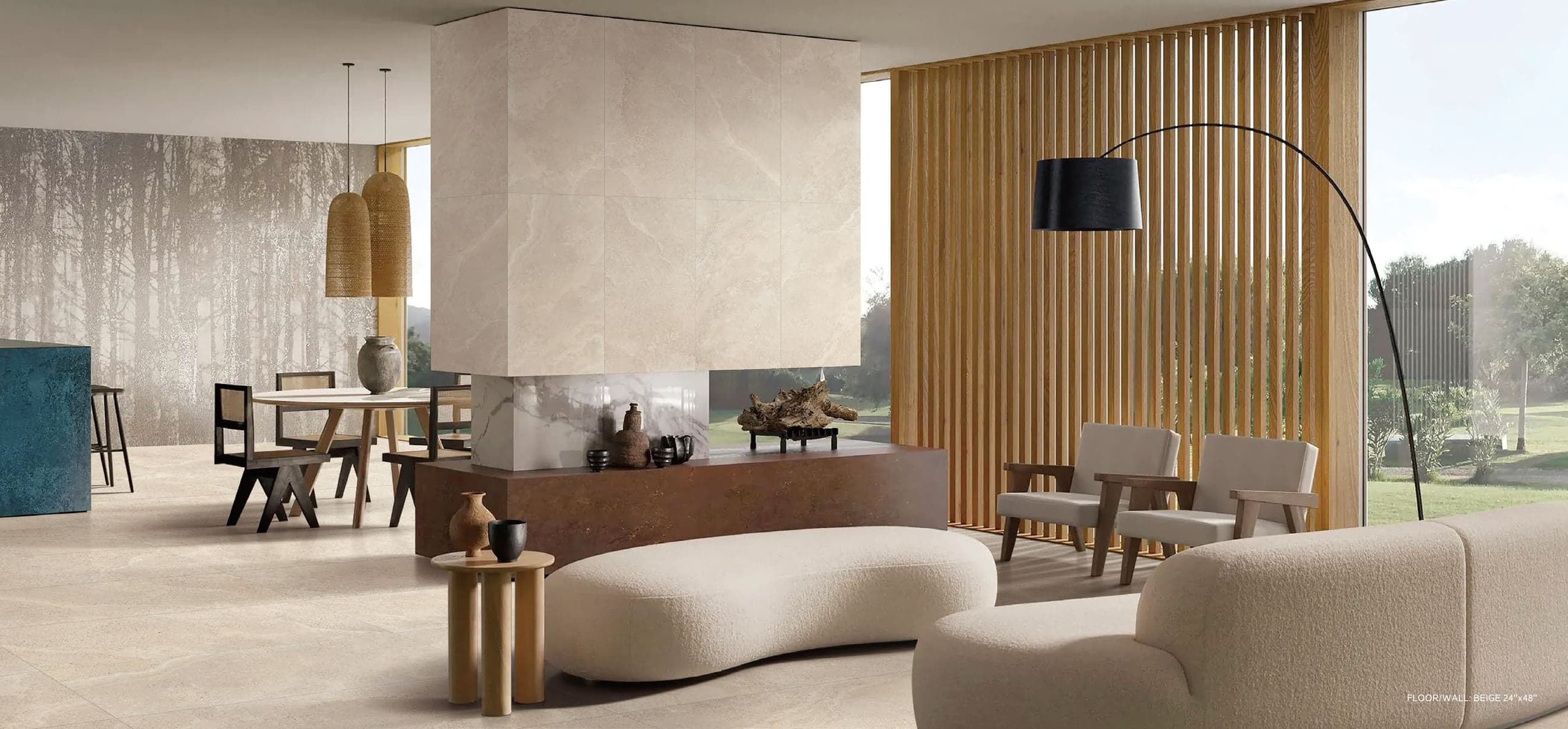 A contemporary living room finished in Padua porcelain, opening onto a garden