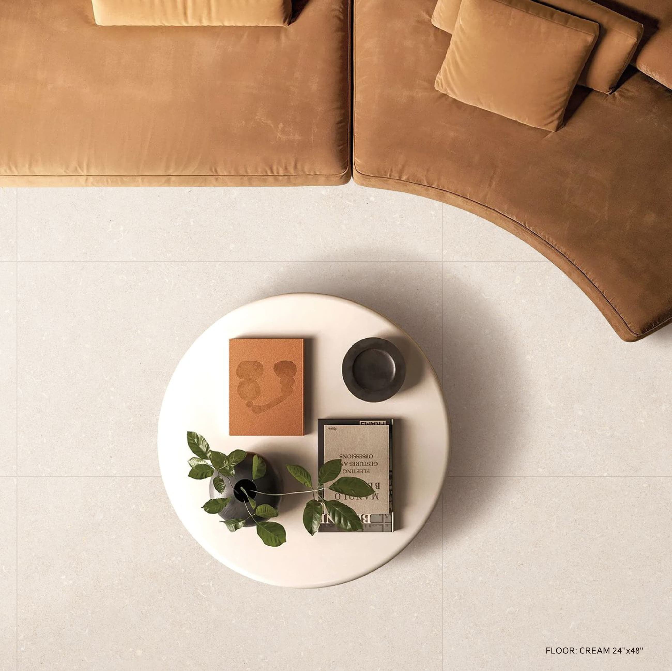 LIMESTONE Cream floor with curved velvet sofa